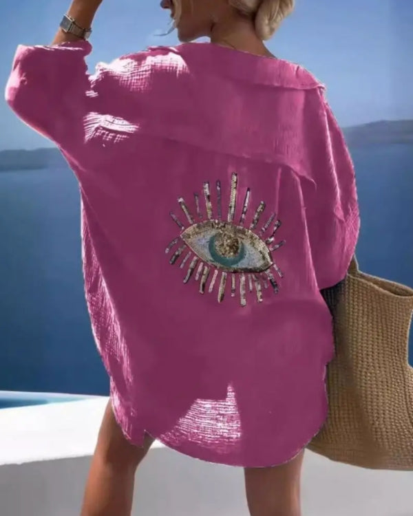 pinke Baumwolle Bluse im Oversize Schnitt, mit Kragen und Pailletten Auge Symbol auf der Rückseite