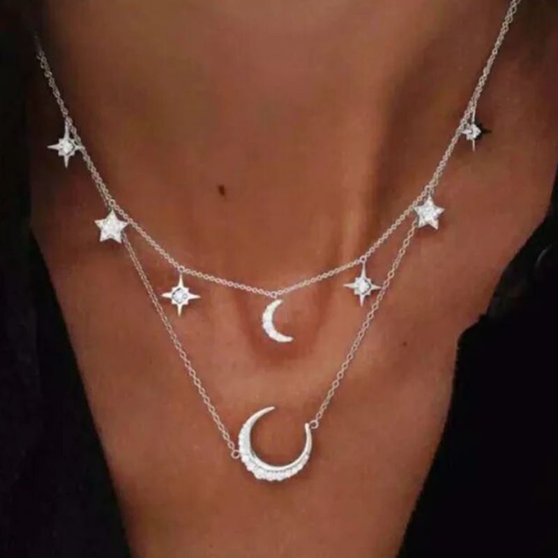 Modeschmuck Halskette in silver mit Sternen und Mond Anhängern 
