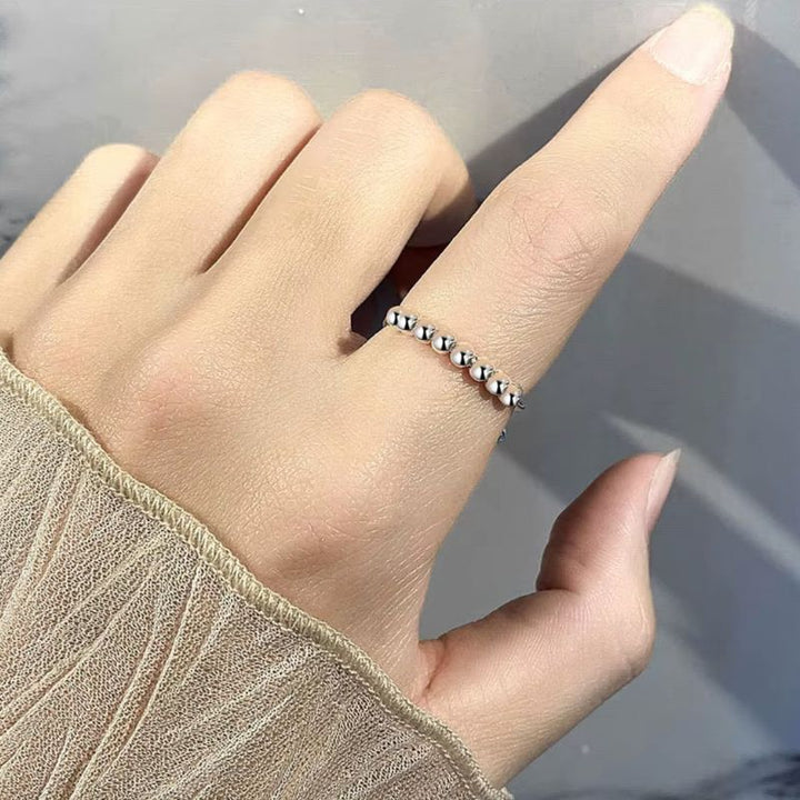 Silberner Anti-Stress Ring mit beweglichen Perlen zum hin und her schieben 