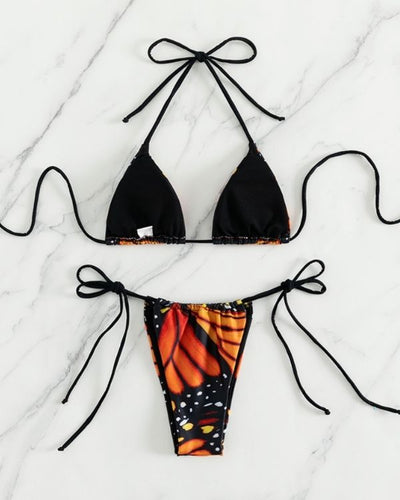 Bikini mit auffälligem schmetterlingsartigem Print: Schwarz-orangefarbene Kombination