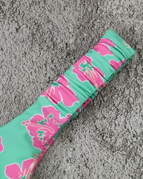 High-Waist Badehose mit elastischem Band in grün mit pinken Hibiskus Blumen 