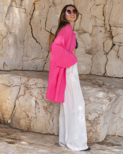 Stilvolle pinkfarbene Oversize-Bluse aus gauze Baumwolle mit Fledermausärmeln und Aufdruck