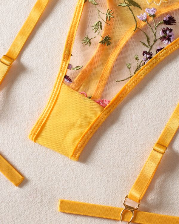 String Tanga in gelb aus Mesh Stoff mit Blumen Stickereien und Strapsen Halterung 