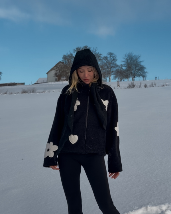 Schwarze Fleece Jacke mit Blumen Muster in weiss 