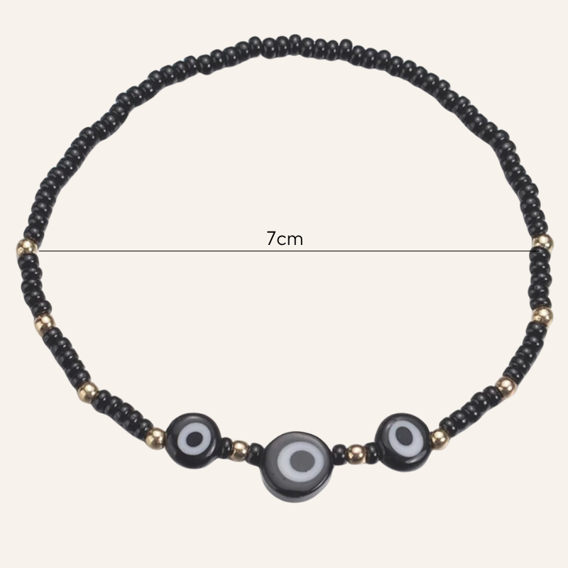 Minimalistische schwarze Fusskette mit Augen Symbol