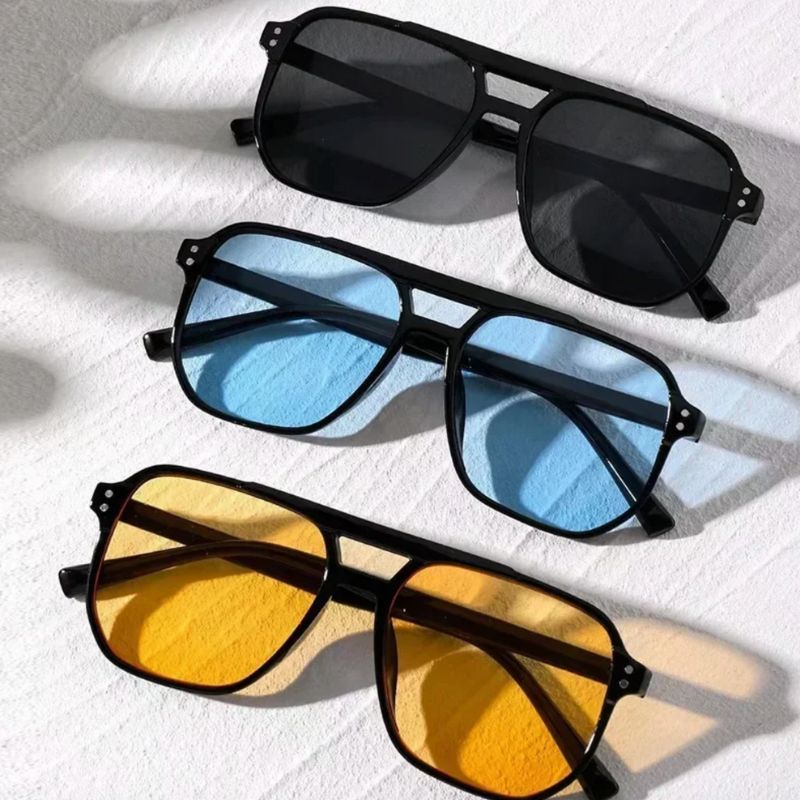 Stillvolle Unisex Sonnenbrille mit farbigen Gläsern in gelb, blau und schwarz