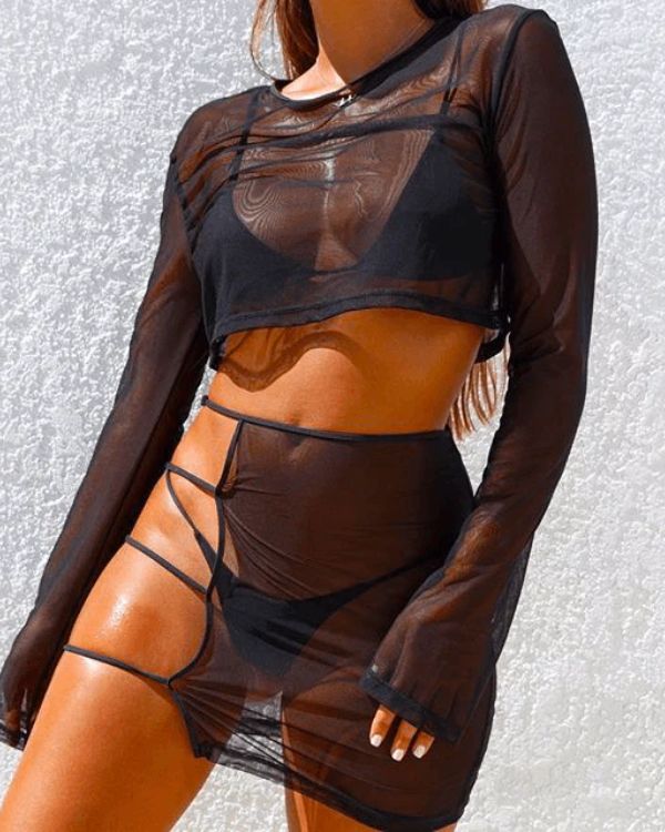 schwarzes Festival Outfit Set aus Mini Rock mit Bändern und Cut-Outs und langarm Oberteil in Mesh Stoff 