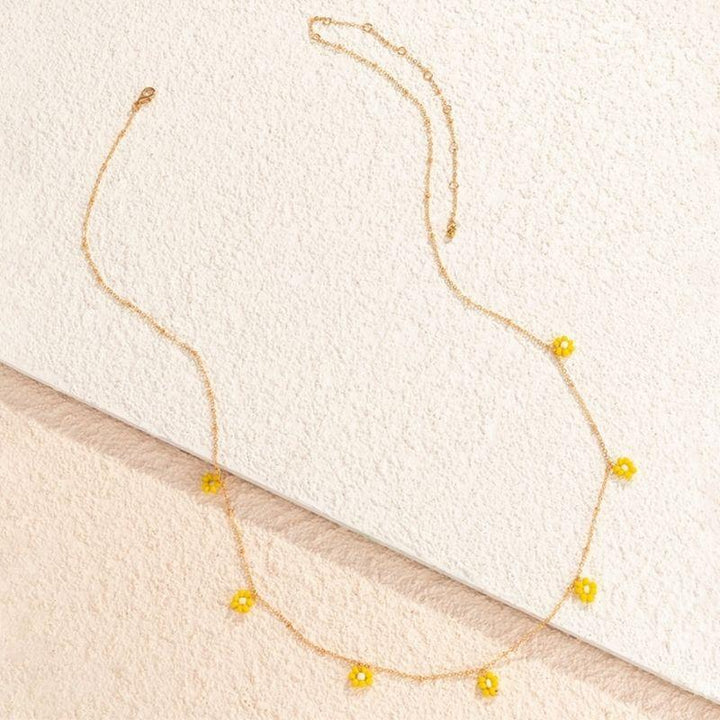 goldene Bauchkette mit Blumen Anhangnern in gelb - Vintager Blumen Perlen
