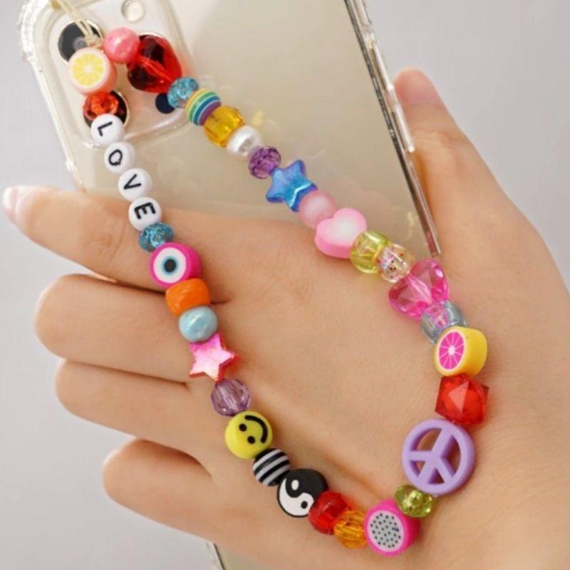 Farbige Handykette Perlenkette aus vielen bunten Perlen mit Fruechten, Herzen, Sternen, Smileys, Peace Zeichen und Yin Yang Symbol - Smartphone Accessoires online bestellen