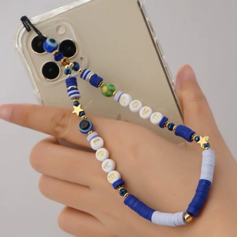 Blaue Perlen Handykette mit goldenen Sternen, Fatima Auge und Love Buchstaben