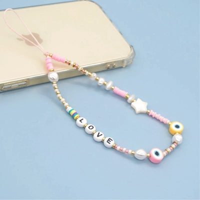 Love Buchstaben, weisse und Rosa Perlen an einer Kette - Smartphone Accessoires Handyketten online bestellen Schweiz
