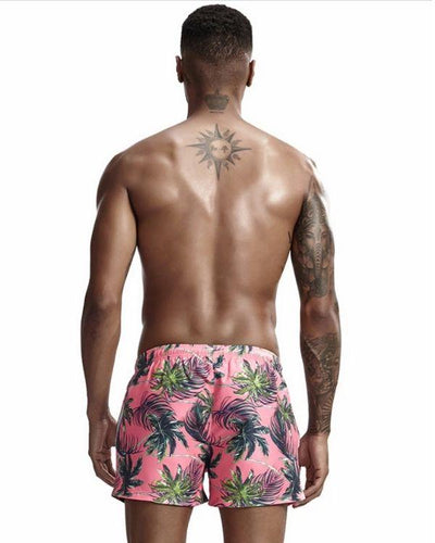 Stylische Pinke Badehosen Herren mit Palmen Motiven