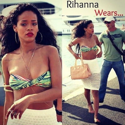 Rihanna mit Bauchkette Koerperschmuck in gold mit Kreuz Symbol