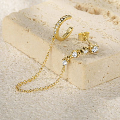 Dieser elegante Ear-Cuff Ohrring ist aus hochwertigem Sterling Silber 925 gefertigt und mit funkelnden Zirconia Steinen verziert, die jedes Outfit aufwerten.