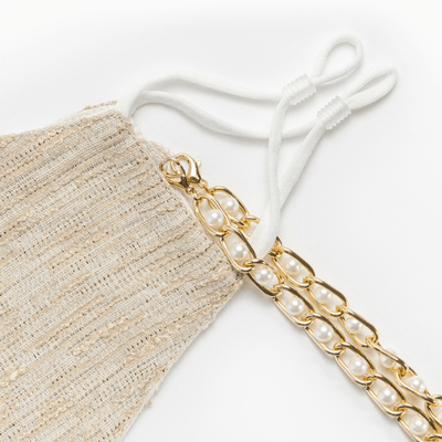 Designer Seidenmaske Schweiz | Ibiza Style Stoffmaske aus Seide und Baumwolle | Maskenkette und Maske in einem | Perlenkette in gild und einzigartige beige goldene Maske | Island Masken Kollektion Schweiz